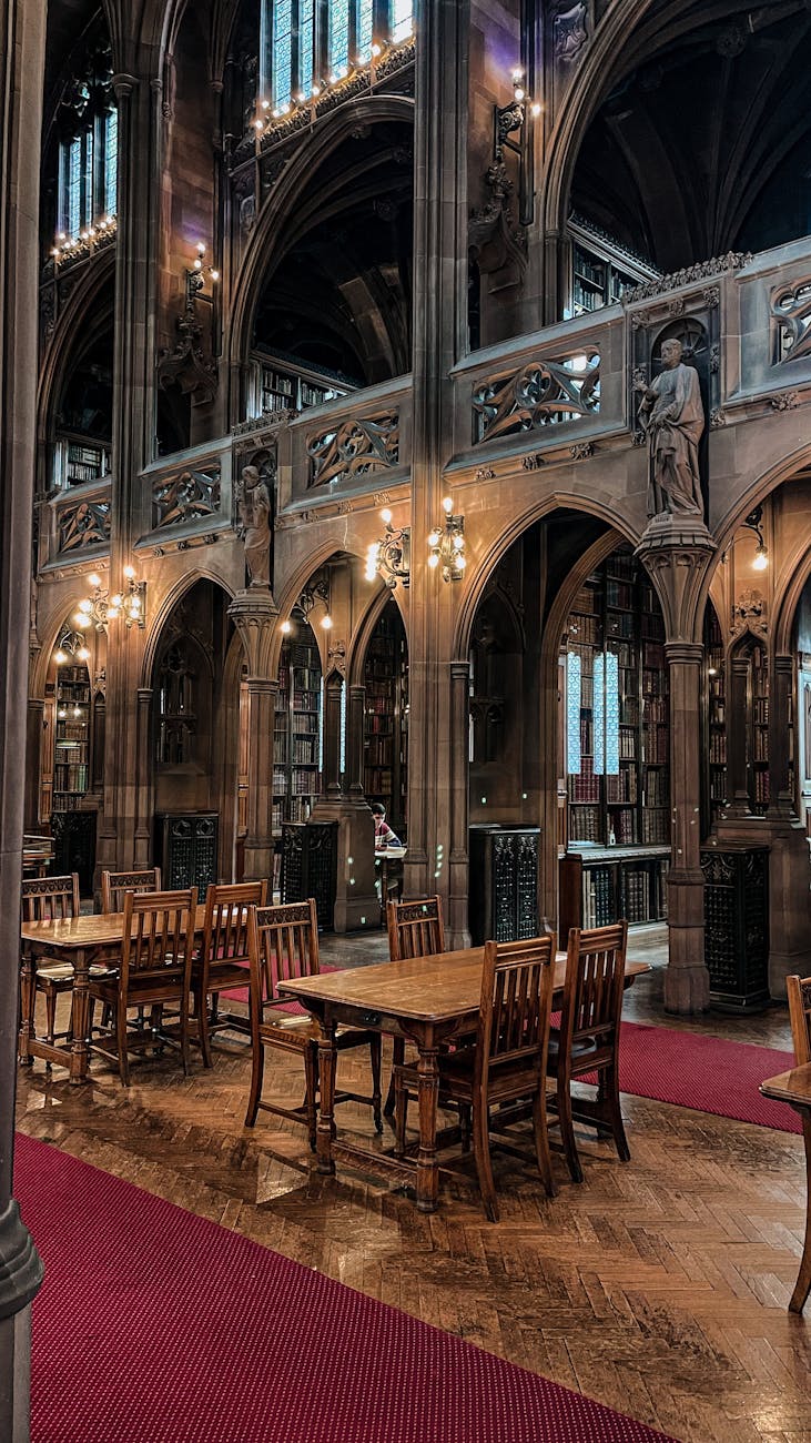 wooden tables and chairs inside the building